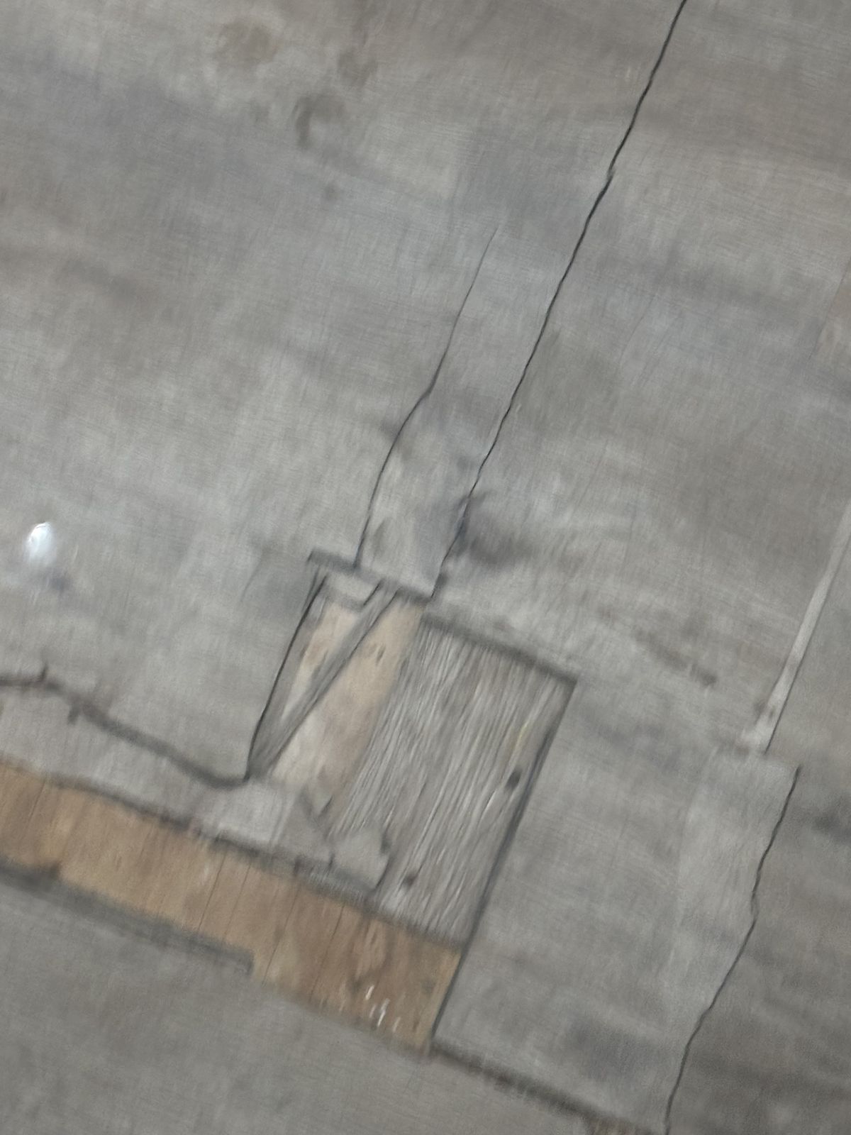 Damaged flooring before repair
